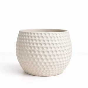 Off white dimpled pot with textured circular pattern 23.5cm decorative ceramic planter on white background