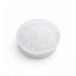 Magnesium sulphate crystals in clear container with fine granular texture on white background