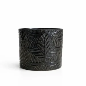 Black palm leaf ceramic cover pot 13cm with glossy finish and embossed tropical foliage pattern on white background