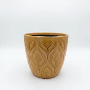 Mustard leaf pattern ceramic cover pot 19cm with raised botanical design and warm glazed finish on white background