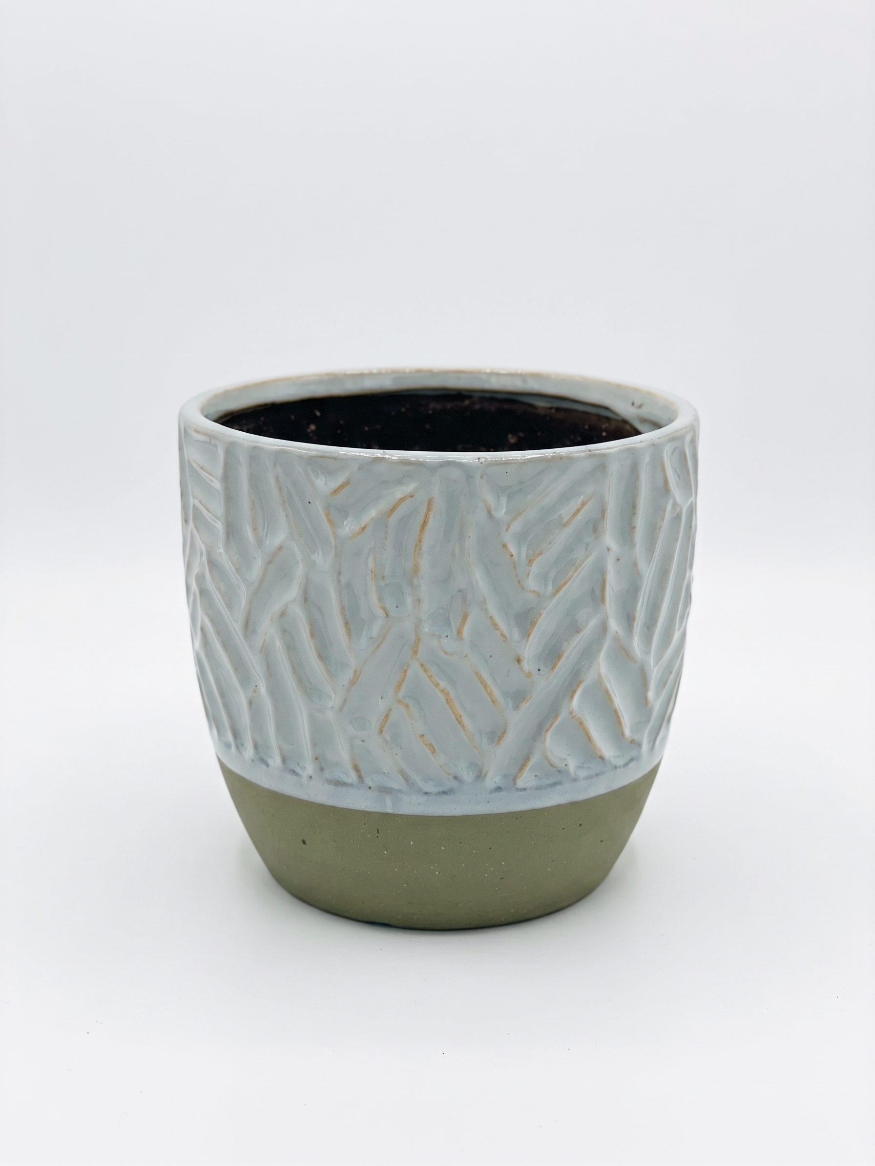 Blue Abstract Ceramic Pot with raised geometric pattern, glossy blue glaze and contrasting natural-coloured base on a white background